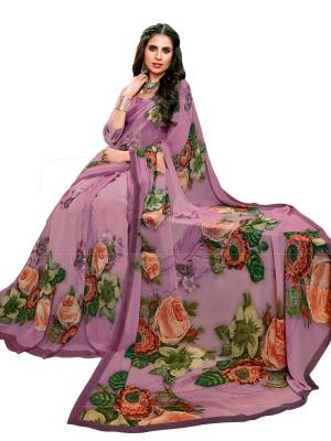 Look Attractive In This Purple Colored Saree Paired With Purple Colored Blouse. This Saree And Blouse Are Fabricated On Georgette Beautified With Bold Floral Prints. Buy This Saree Now.