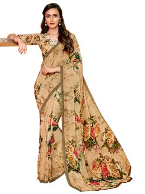Flaunt Your Rich And Elegant Taste Wearing This Saree In Beige Color Paired With Beige Colored Blouse. This Saree And Blouse Are Fabricated On Georgette Beautified With Bold Floral Prints All Over.
