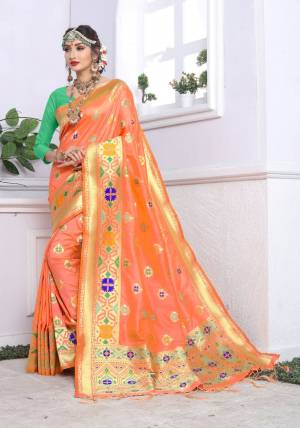 Orange Color Induces Perfect Summery Appeal To Any Outfit, So Grab This Saree For This Summer In Orange Color Paired With Contrasting Green Colored Blouse. This Saree And Blouse Are Fabricated On Banarasi Art Silk Beautified With Weave And Tassels At The Pallu.