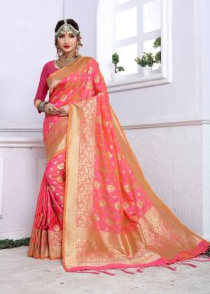 Bright And Visually Appealing Color Is Here With This Silk Saree In Fuschia Pink Color Paired With Fuschia Pink Colored Blouse. This Saree And Blouse Are Fabricated On Banarasi Art Silk Beautified With Weave All Over It. Buy This Attractive Silk Saree Now.