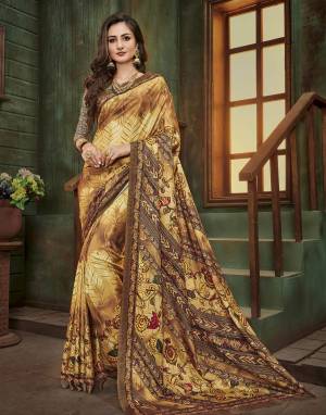 Enhance Your Personality Wearing This Saree In Brown Color Paired With Brown Colored Blouse. This Saree And Blouse Are Fabricated On Cotton Silk Beautified With Multiple Prints All Over The Saree.