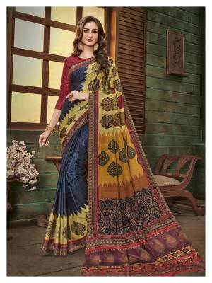 New And Unique Patterned Saree In Here In Navy Blue And Multi Color Paired With Maroon Colored Blouse, This Saree And Blouse Are Fabricated On Cotton Silkn Beautified With Prints All Over It. 
