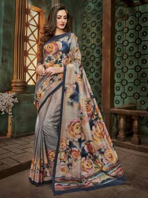 Flaunt Your Rich And Elegant Taste Wearing This Saree In Grey And Multi Color Paired With Contrasting Navy Blue Colored Blouse. This Saree And Blouse Are Fabricated On Cotton Silk Beautified With Bold Prints All Over It. Buy This Saree Now.