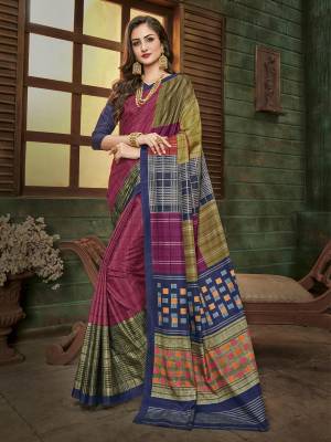 Add This Semi-Casual Wear Saree To Your Wardrobe In Magenta Pink And Multi Color Paired With Navy Blue Colored Blouse. This Saree And Blouse Are Fabricated On Cotton Silk Beautified With Prints All Over It. It Is Light Weight And Easy To Drape. 