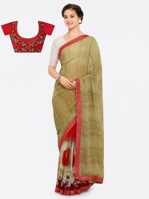 New Combination In Saree Is Here With This Mint Green And Red Colored Saree Paired With Red Colored Blouse. This Saree Is Fabricated On Georgette Paired With Art Silk Fabricated Blouse. It Has Lovely Prints Over The Saree And Embroidery Over The Blouse. 
