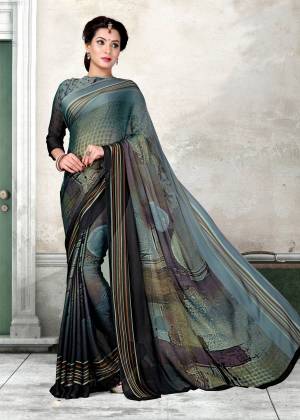 For A Bold And Beautiful Look, Grab This Lovely Saree In Grey And Black Color Paired With Grey And Black Colored Blouse. This Saree And Blouse are Fabricated On Chiffon Beautified With Prints. Buy This Elegant Looking Saree Now.