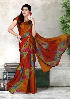 New And Unique Shade Is Here To Add Up Into Your Wardrobe Is Here In Rust Orange Color Paired With Rust Orange Colored Blouse. This Saree And Blouse are Fabricated On Chiffon Beautified With Prints All Over. Buy Now.