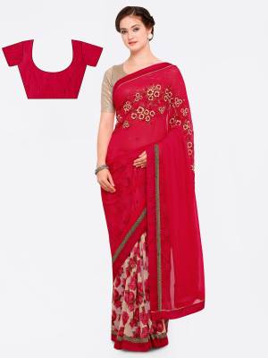 Adorn The Angelic Look Wearing This Saree In Red And Cream Color Paired With Red Colored Blouse. This Saree Is Fabricated On Georgette Paired With Art Silk Fabricated Blouse It Has Beautiful Floral Prints And Embroidery Making The Saree More Attractive.