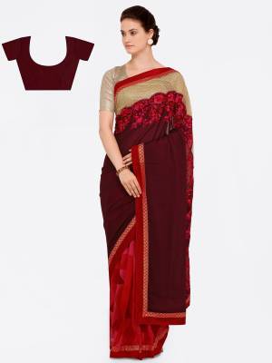 Attract All Wearing This Designer Saree In Maroon And Red Color Paired With Maroon Colored Blouse. This Saree Is Fabricated On Georgette Paired With Art Silk Fabricated Blouse. Both The fabrics Ensures Superb Comfort All day Long.