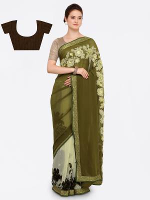 New Shades Of Green Are Here With This Saree In Olive Green And Pastel Green Color Paired With Brown Colored Blouse. This Saree Is Fabricated On Georgette Paired With Art Silk Fabricated Blouse. It Has Bold Prints And Embroidery Over the Saree.