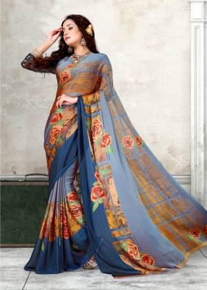 Go With The Shades Of Blue With This Pretty Saree In Multiple Shades Of Blue Paired With Blue Colored Blouse. This Saree And Blouse Are Fabricated On Chiffon Beautified With Prints All Over. Buy This Saree Now.