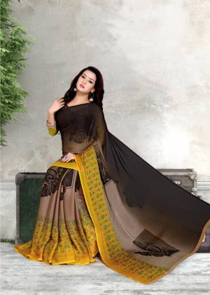 Elegant And Rich Look Saree Is Here In Black And Yellow Color Paired With Black and Yellow Colored Blouse. This Saree And Blouse Are Fabricated On Chiffon Beautified With Bold And Intricate Prints Over The Saree Panel.