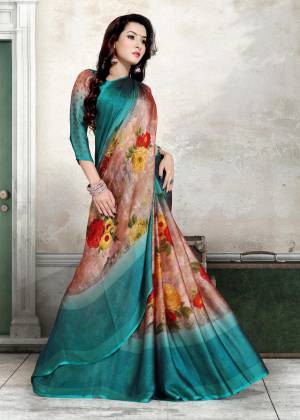 For Your Casual Wear, Add This Pretty Saree To Your Wardrobe In Blue And Multi Color Paired With Blue Colored Blouse. This Saree And Blouse Are Fabricated On Chiffon Beautified With Multi Colored Floral Prints. Buy This Saree Now.