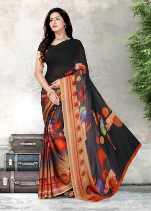 Enhance Your Personalityn Wearing This Saree In Black Color Paired With Black Colored Blouse. This Saree And Blouse are Fabricated On Chiffon Beautified With Prints. It Is Easy To Drape And Carry All Day Long.