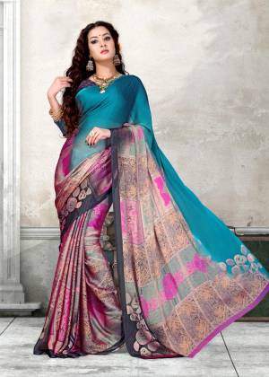 For Your Casual Wear, Add This Pretty Saree To Your Wardrobe In Blue And Multi Color Paired With Contrasting Dark Grey Colored Blouse. This Saree And Blouse Are Fabricated On Chiffon Beautified With Multi Colored Floral Prints. Buy This Saree Now.