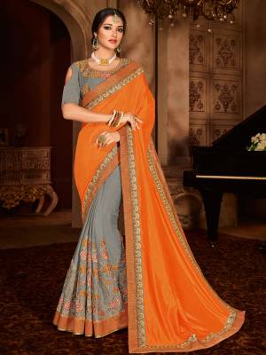 You can this amazing saree and look pretty like never before. wearing this orange and grey color two tone silk and bright georgette saree. this gorgeous saree featuring a beautiful mix of designs. look gorgeous at an upcoming any occasion wearing the saree. Its attractive color and designer embroidered design, patch design, stone, designer blouse, beautiful floral design work over the attire & contrast hemline adds to the look. Comes along with a contrast unstitched blouse.