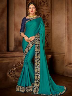 Impress everyone with your amazing Trendy look by draping this Teal Blue color satin silk saree. this party wear saree won't fail to impress everyone around you. this gorgeous saree featuring a beautiful mix of designs. Its attractive color and designer embroidered design, designer blouse, beautiful floral design work over the attire & contrast hemline adds to the look. Comes along with a contrast unstitched blouse.