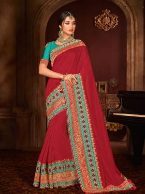Presenting this red color silk fabrics saree. look gorgeous at an upcoming any occasion wearing the saree. this party wear saree won't fail to impress everyone around you. Its attractive color and designer embroidered design, patch design, stone, moti, heavy designer blouse, beautiful floral design work over the attire & contrast hemline adds to the look. Comes along with a contrast unstitched blouse.