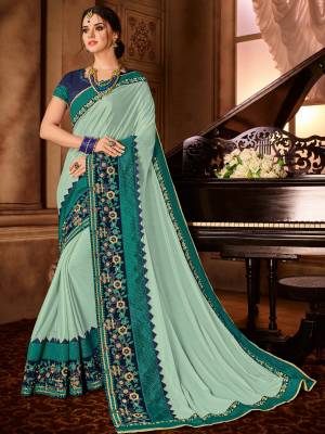 The fabulous pattern makes this Baby Blue color glitter lycra saree. Ideal for party, festive & social gatherings. this gorgeous saree featuring a beautiful mix of designs. Its attractive color and designer embroidered design, patch design, stone, moti, heavy designer blouse, beautiful floral design work over the attire & contrast hemline adds to the look. Comes along with a contrast unstitched blouse.