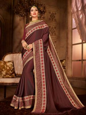 Gorgeously mesmerizing is what you will look at the next wedding gala wearing this beautiful dark Brown color satin silk saree. Ideal for party, festive & social gatherings. this gorgeous saree featuring a beautiful mix of designs. Its attractive color and designer embroidered design, patch design, stone, moti, heavy designer blouse, beautiful floral design work over the attire & contrast hemline adds to the look. Comes along with a contrast unstitched blouse.