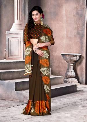 Enhance Your Beauty Wearing this Saree In Dark Brown Color Paired With Dark Brown Colored Blouse. This Saree And Blouse are Fabricated On Satin Silk Beautified With Bold Prints And Polka Dots. Buy This Saree Now.