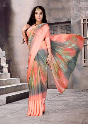 You Will Definitely Earn Lots Of Compliments Wearing this Saree In Peach And Grey Color Paired With Peach And Grey Colored Blouse. This Saree And Blouse Are Fabricated On Satin Silk. This Pretty Saree Is Light Weight, Durable And Easy To Care For.