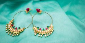 Give An Elegant Look Wearing This Pretty Earrings Set In Golden Color Beautified With Multi Colored Stones. It Is Also Light Weight And Earn You Lots Of Compliments From Onlookers.