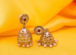 Grab This Lovely Jhumka Styled Earrings Set In Golden Color Beautified With stone And Pearls. It Is Light Weight And Easy To Carry Throughout The Gala. Buy Now.