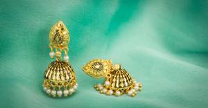 Pair Up Such Cute And Delicate Earrings With Your Simple Kurti Or Heavy Dress. These Earrings Are In Golden color And Can Be Paired With Any Colored Attire. 