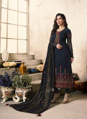 Enhance Your  Personality Wearing This Designer Straight Cut suit In Navy Blue Color Paired With Navy Blue Colored Bottom And Dupatta. Its Top Is Fabricated On Georgette Paired With Santoon Bottom And Chiffon Dupatta. It Has Detailed Attractive Embroidery Which Will Earn You Lots Of Compliments From Onlookers.