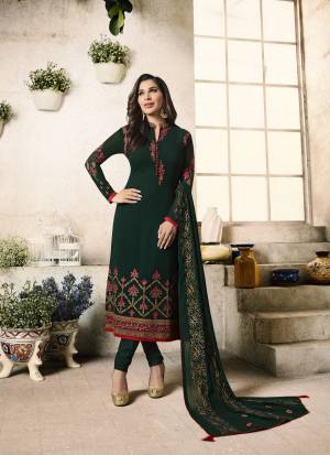 Here Is An Attractive And Beautiful Shade In Green With This Pine Green Colored Top Paired With Pine Green Colored Bottom And Dupatta. Its Top Is Fabricated On Georgette Paired with Santoon Bottom And Chiffon Dupatta. It Has Beautiful Contrasting Embroidery Ovwe The Top And Dupatta. Buy Now.