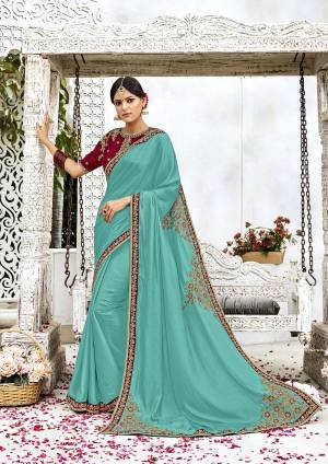 Grab This Beautiful Color Combination With This Designer Saree In Turquoise Blue Color Paired With Contrasting Maroon Colored Blouse, This Saree Is Fabricated On Soft Silk Paired With Art Silk Fabricated Blouse. It Is Beautified With Attractive Embroidery Over The Saree And Blouse. 