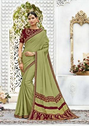 You Will Definitely Earn Lots If Compliments Wearing This Designer Saree In Light Green Color Paired With Contrasting Maroon Colored Blouse. This Saree Is Fabricated On Soft Silk Paired With Art Silk Fabricated Blouse. It Has Beautiful Contrast In Color And Attractive Embroidery. Buy This Saree Now.