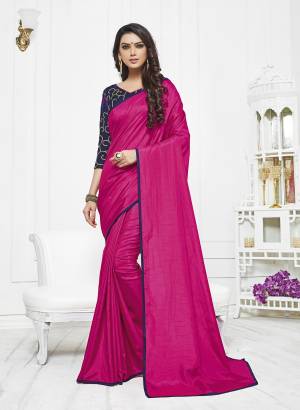 Bright And Visually Appealing Color Is Here With This Designer Saree In Dark Pink Color Paired With Contrasting Navy Blue Colored Blouse. This Saree Is Fabricated On Satin Silk Paired With Art Silk Fabricated Blouse. It Has Heavy Embroidery Over The Blouse. 