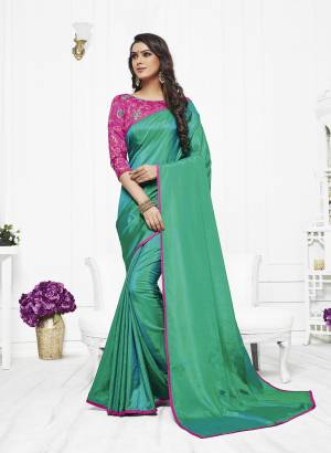 New Shade In Green Is Here With this Saree In Sea Green Color Paired With Contrasting Pink Colored Blouse. This Saree Is Fabricated On Satin Silk Paired With Art Silk Fabricated Blouse. Buy This Saree Now.