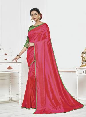 Shine Bright In This Fuschia Pink Colored Saree Paired With Contrasting Green Colored Blouse. This Saree Is Fabricated On Satin Silk Paired With Art Silk Fabricated Blouse. It Is Beautified With Embroidery Over The Blouse. 