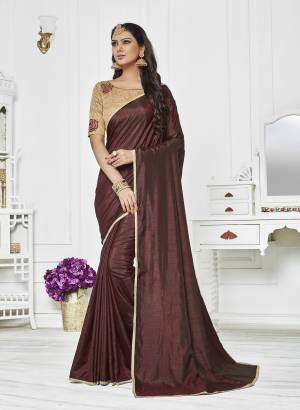 Enhance Your Personality Wearing This Saree In Brown Color Paired With Beige Colored Blouse. This Saree Is Fabricated On Satin Silk Paired With Art Silk Fabricated Blouse. It Is Light Weight And Ensures Superb Comfort All Day Long.