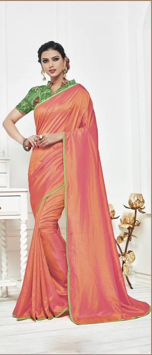 Look Pretty In This Peach Colored Saree Paired With Contrasting Light Green Colored Blouse, This Saree Is Fabricated On Satin Silk Paired With Art Silk Fabricated Blouse. Buy This Saree Now.