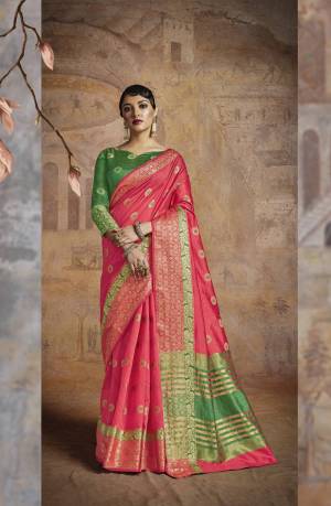 Shine Bright Wearing This Saree In Bright Pink Color Paired With Contrasting Green Colored Blouse. This Saree And Blouse Are Fabricated On Handloom Art Silk Beautified With Weave. Buy This Saree Now.