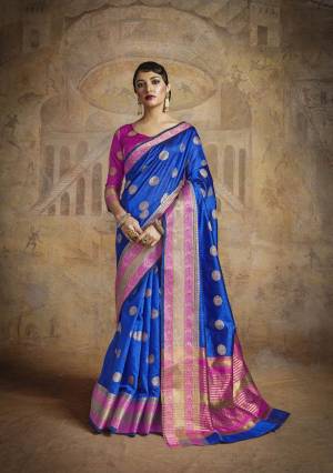 Attract All Wearing This Saree In Royal Blue Color Paired With Contrasting Magenta Pink Colored Blouse. This Saree And Blouse Are Fabricated On Handloom Art Silk With Weave All Over It.