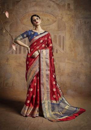 Adorn The Royal Look Wearing This Saree In Maroon Color Paired With Contrasting Blue Colored Blouse. This Saree And Blouse Are Fabricated On Handloom Art Silk Beautified With Weave. Buy This Saree Now.