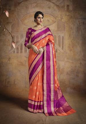 Orange Color Induces Perfect Summery Appeal To Any Outfit, So Grab This Silk Saree In Orange Color Paired With Another Bright Shade That Is Rani Pink Colored Blouse. This Saree And Blouse Are Fabricated On Handloom Art Silk Beautified With Weave All Over It. Buy This Saree Now.