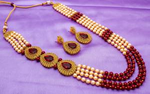 Adorn the Royal Queen Look With This Rich Looking Necklace Set In golden And Maroon Color. This Necklace Set Can Be Paired With Any Ethnic Attire In Maroon Or Any Contrasting Color. Buy Now.