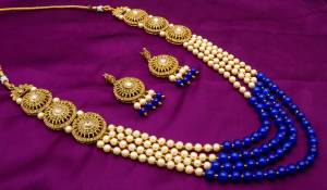 Enhance Your Traditonal Look Pairing It With This Beautiful Necklace Set In Golden And Blue Color Beautified With Moti And Stone Work. Buy This Set Now.