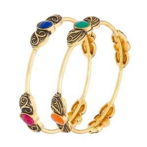 Grab This Pretty Elegant Set Of Bangles In Golden Color Beautified With Four Side Multi Colored Stones. This Bangle Set Is Suitable For Your Casual Or Semi-Casual Wear. Buy Now.