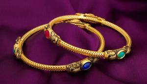 Grab This Pretty Elegant Set Of Bangles In Golden Color Beautified With Four Side Multi Colored Stones. This Bangle Set Is Suitable For Your Casual Or Semi-Casual Wear. Buy Now.