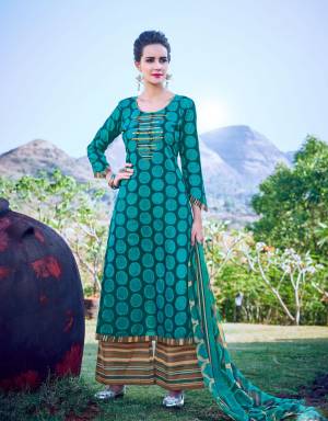 For Your Casual Wear, Grab This Dress Material In Blue Colored Top Paired With Brown Colored Bottom And Blue Dupatta. Its Top And Bottom Are Fabricated On Cotton Paired With Chiffon Dupatta. Its Fabric Is Soft Towards Skin And Easy To Carry All Day Long.