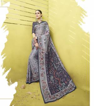 Flaunt Your Rich and Elegant Taste Wearing This Saree In Grey Color Paired With Dark Grey Colored Blouse. This Saree And Blouse Are Fabricated On Cotton Silk Beautified With Floral Prints All Over It. 