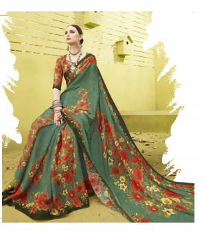For A Beautiful Traditional Look, Grab This Saree In Green Color Paired With Multi Colored Blouse. This Saree And Blouse Are Fabricated On Cotton Silk Beautified With Bold Floral Prints All Over.  It Is Easy To Drape And Carry All Day Long.