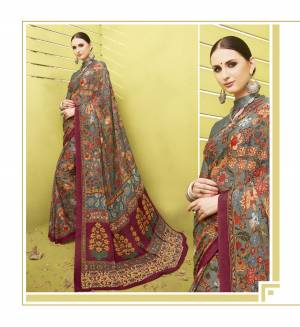 Flaunt Your Rich and Elegant Taste Wearing This Saree In Grey Color Paired With Grey Colored Blouse. This Saree And Blouse Are Fabricated On Cotton Silk Beautified With Colorful Floral Prints All Over It. 